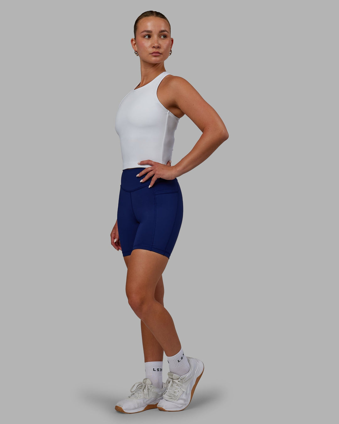 Woman wearing Elite Mid-Length Shorts - Midnight Blue