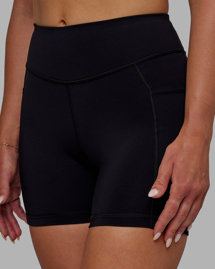 Woman wearing Elite X-Length Shorts - Black
