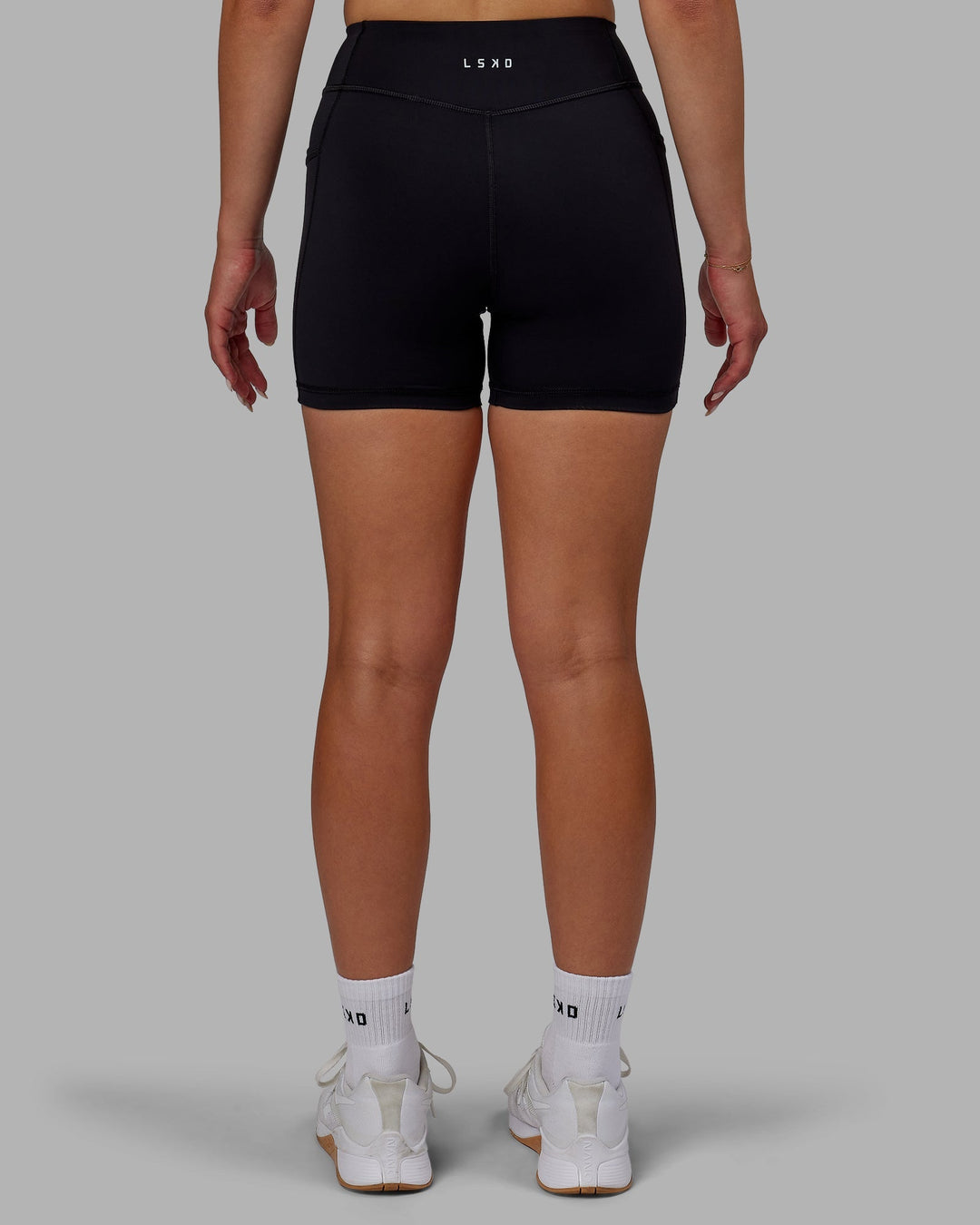 Woman wearing Elite X-Length Shorts - Black