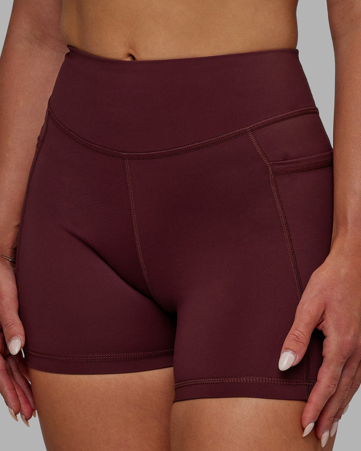 Woman wearing Elite X-Length Shorts - Dark Cherry
