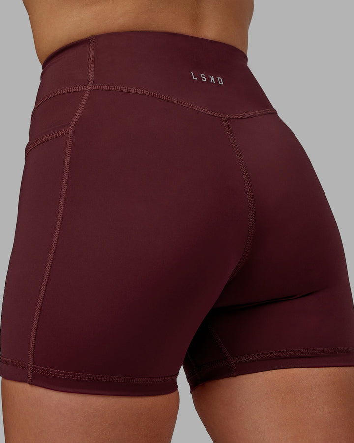 Woman wearing Elite X-Length Shorts - Dark Cherry
