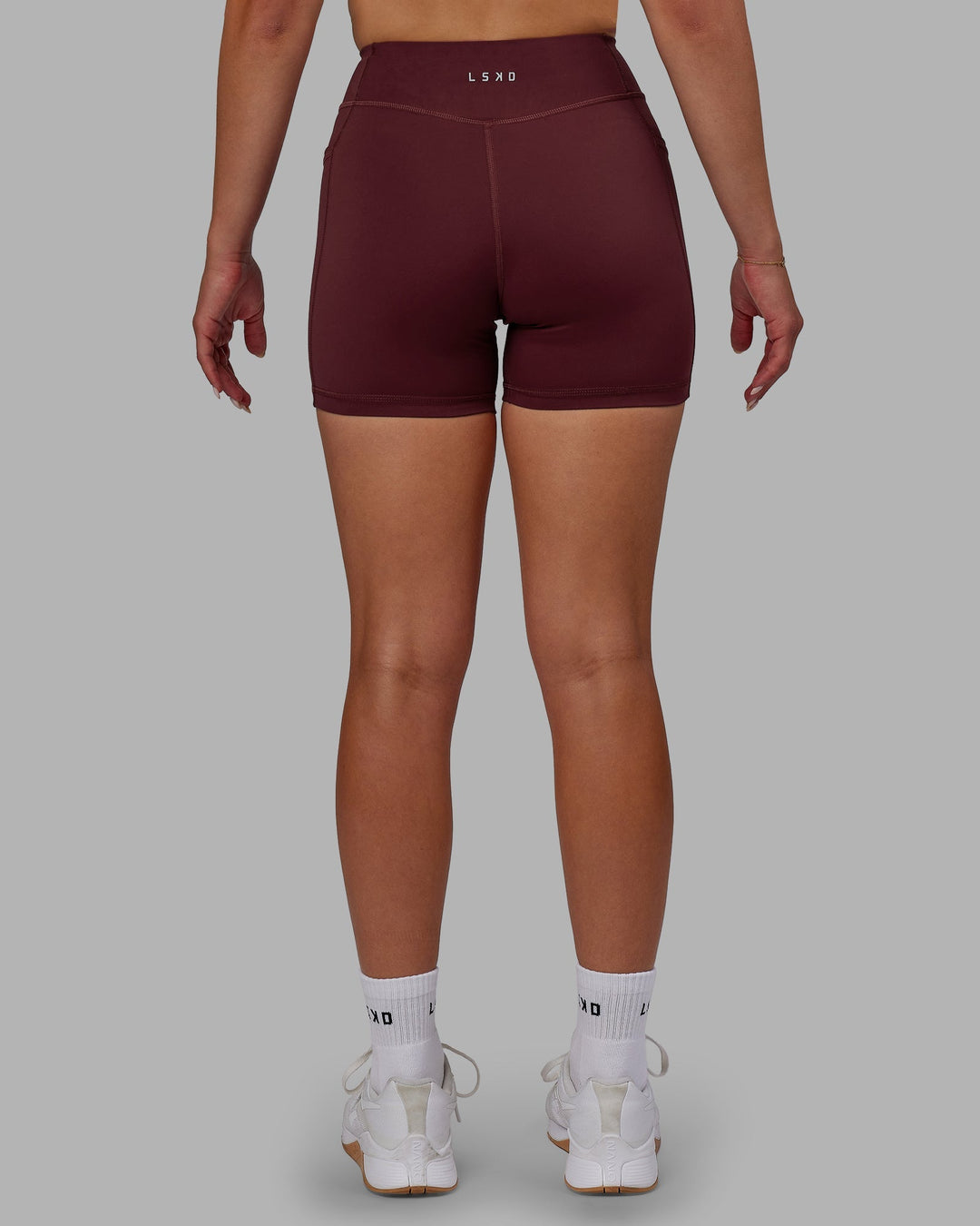 Woman wearing Elite X-Length Shorts - Dark Cherry