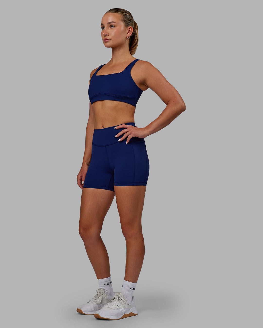 Woman wearing Elite X-Length Shorts - Midnight Blue