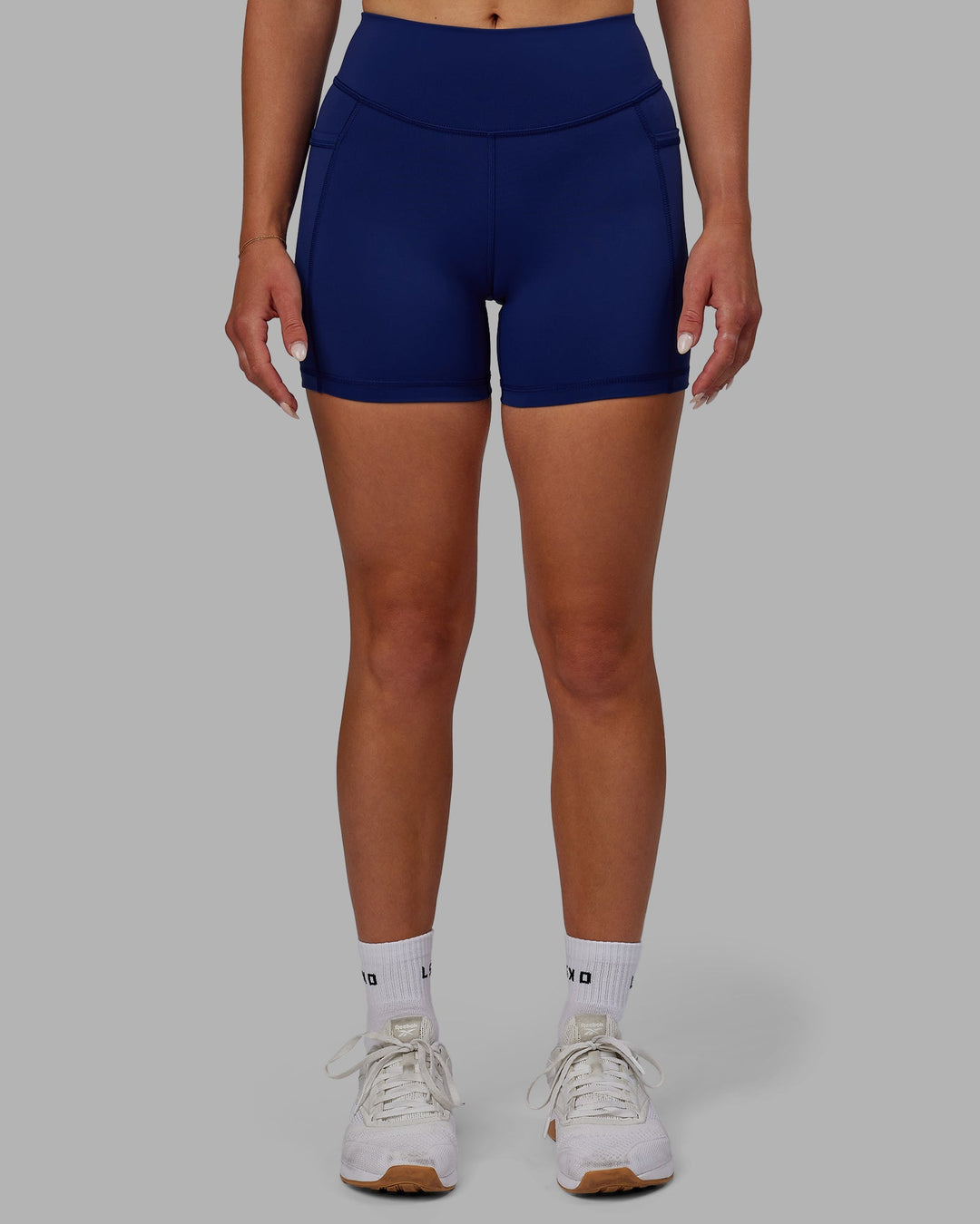 Woman wearing Elite X-Length Shorts - Midnight Blue