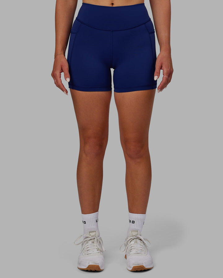 Woman wearing Elite X-Length Shorts - Midnight Blue
