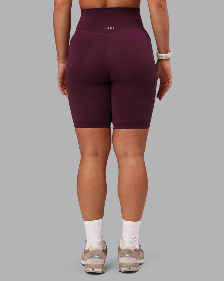 Woman wearing Elixir Bike Shorts With Pockets - Cherry Lacquer
