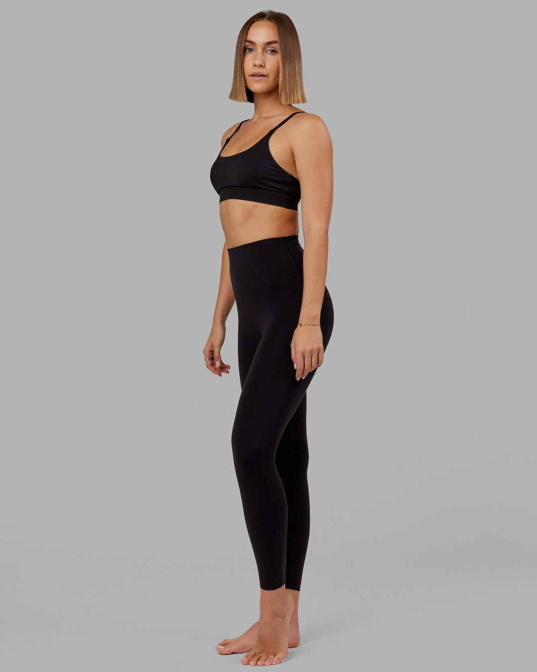 Woman wearing Elixir Full Length Tight - Black No Logo