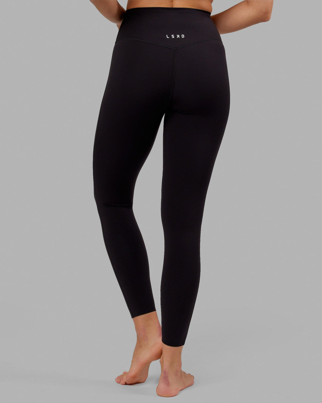 Woman wearing Elixir Full Length Tight - Black No Logo