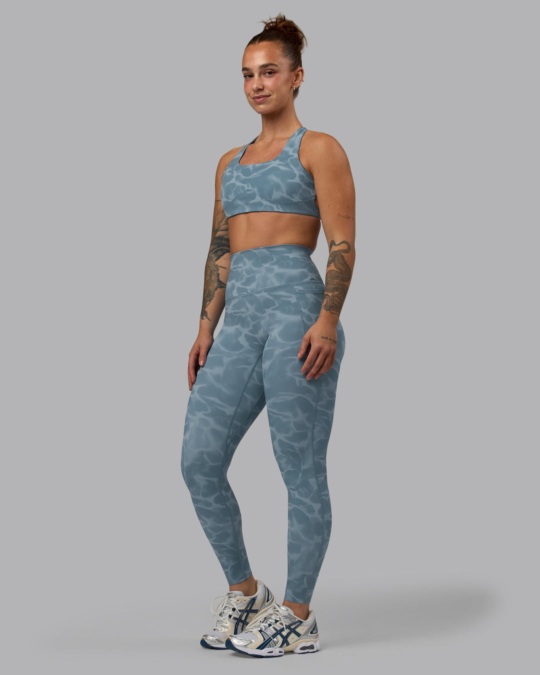 Woman wearing Elixir Full Length Leggings With Pockets - Tranquil-Elemental Blue