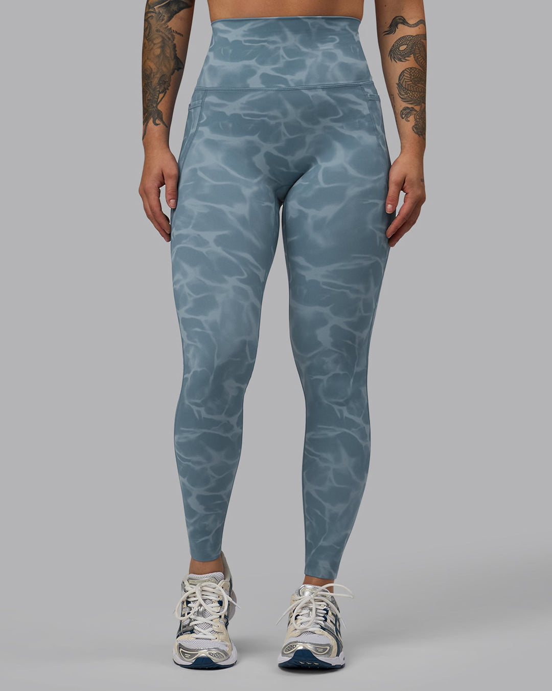 Woman wearing Elixir Full Length Leggings With Pockets - Tranquil-Elemental Blue