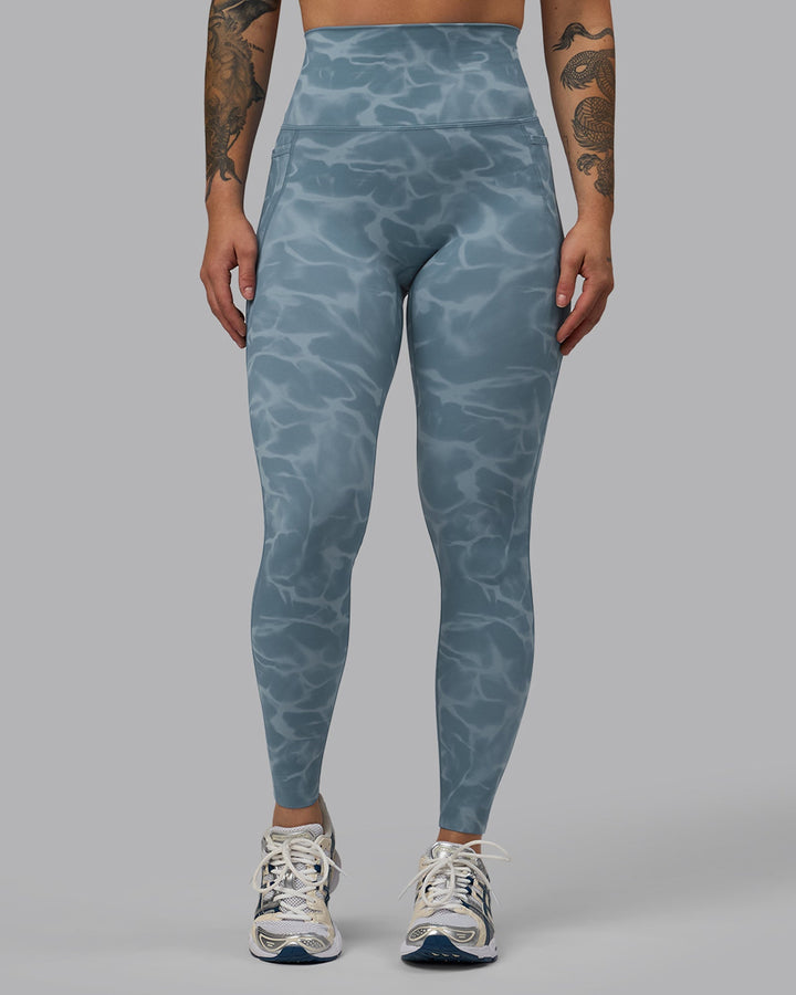 Woman wearing Elixir Full Length Leggings With Pockets - Tranquil-Elemental Blue
