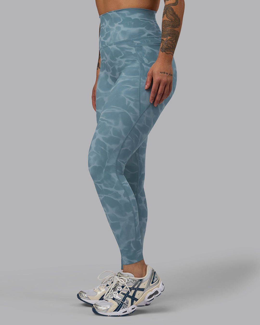 Woman wearing Elixir Full Length Leggings With Pockets - Tranquil-Elemental Blue