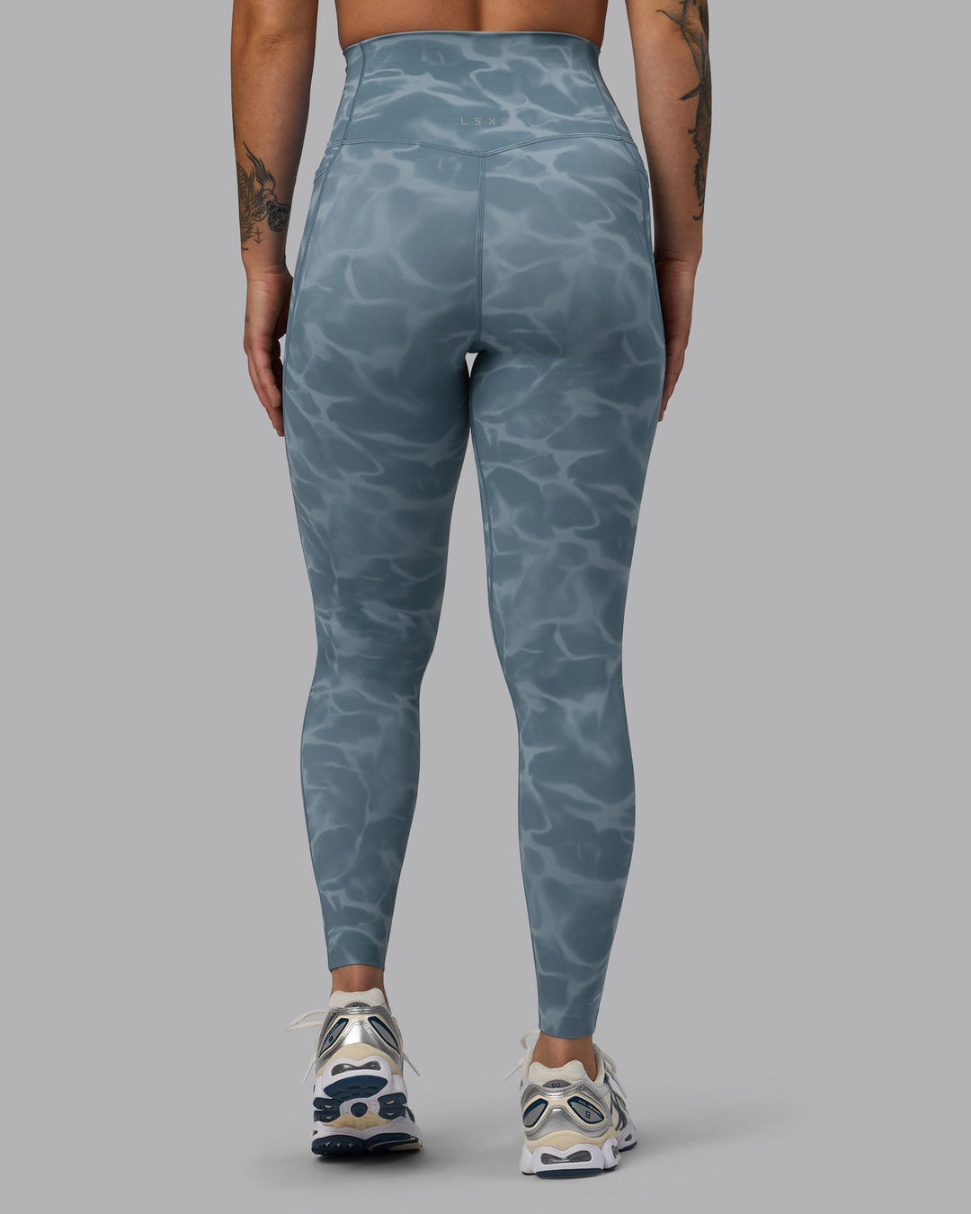 Woman wearing Elixir Full Length Leggings With Pockets - Tranquil-Elemental Blue