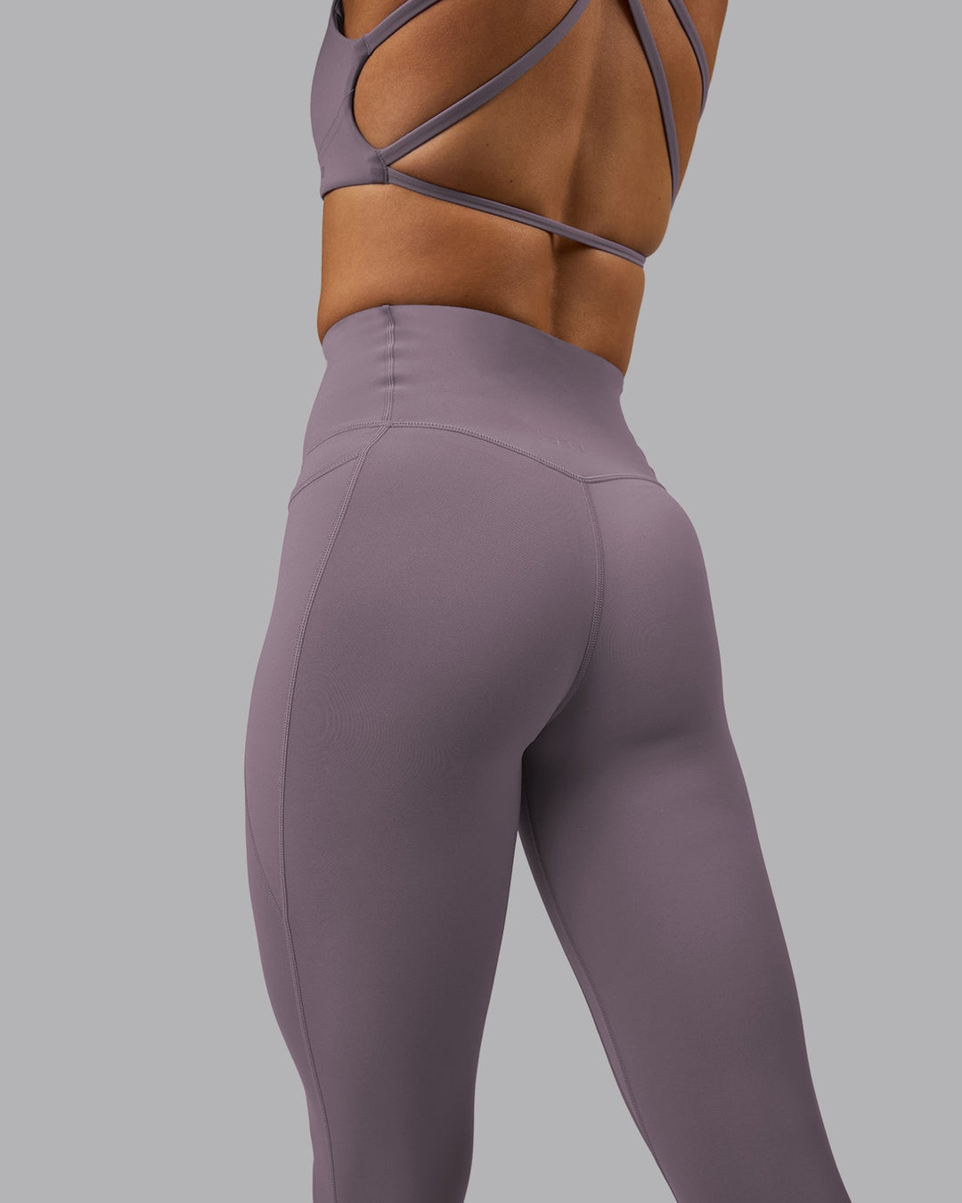 Woman wearing Elixir Ultra High-Rise Full Length Legging Pockets - Purple Sage