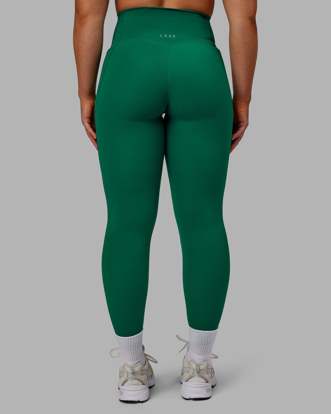 Woman wearing Elixir Full Length Leggings With Pockets - Malachite