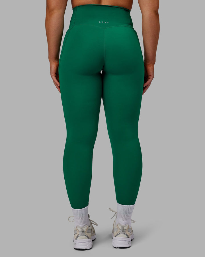 Woman wearing Elixir Full Length Leggings With Pockets - Malachite
