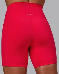 Woman wearing Elixir Ultra High-Rise 6" Short Pockets - Scarlet