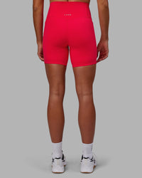 Woman wearing Elixir Ultra High-Rise 6" Short Pockets - Scarlet
