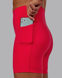 Woman wearing Elixir Ultra High-Rise 6" Short Pockets - Scarlet