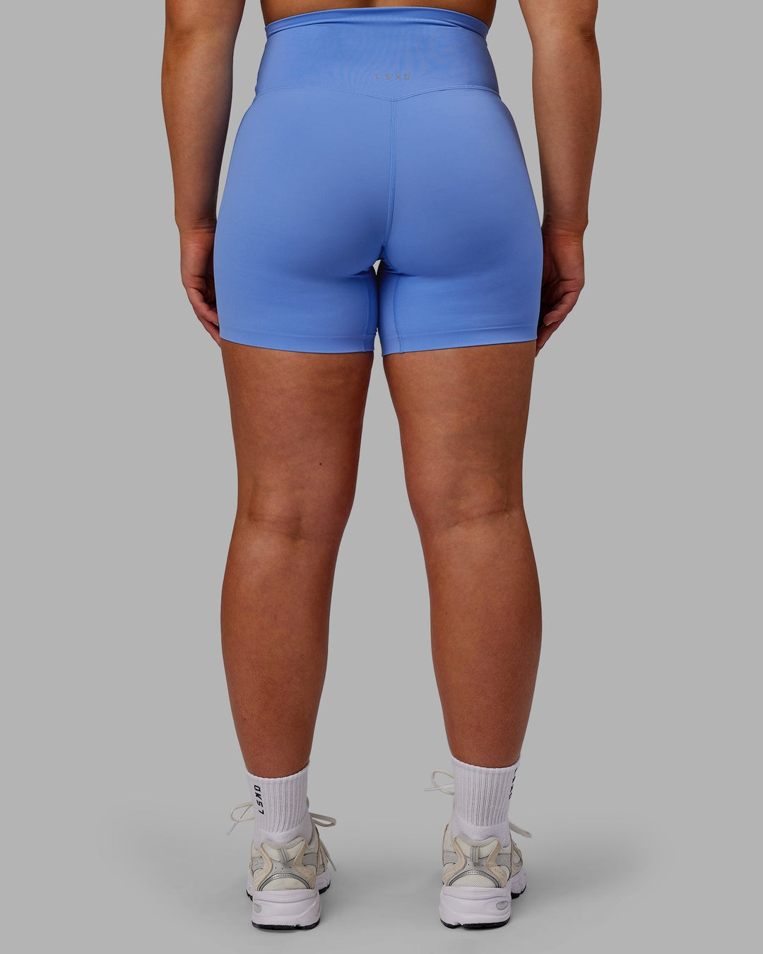 Woman wearing Elixir Mid-Length Shorts - Ultramarine