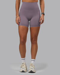 Woman wearing Elixir Ultra High-Rise 6" Short Pockets - Purple Sage