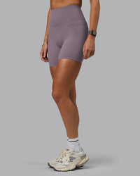 Woman wearing Elixir Ultra High-Rise 6" Short Pockets - Purple Sage