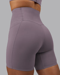 Woman wearing Elixir Ultra High-Rise 6" Short Pockets - Purple Sage