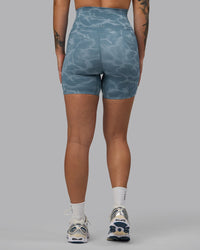 Woman wearing Elixir Ultra High-Rise 6" Short Pockets - Tranquil-Elemental Blue