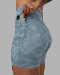 Woman wearing Elixir Ultra High-Rise 6" Short Pockets - Tranquil-Elemental Blue