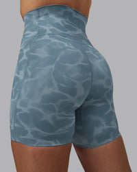 Woman wearing Elixir Ultra High-Rise 6" Short Pockets - Tranquil-Elemental Blue