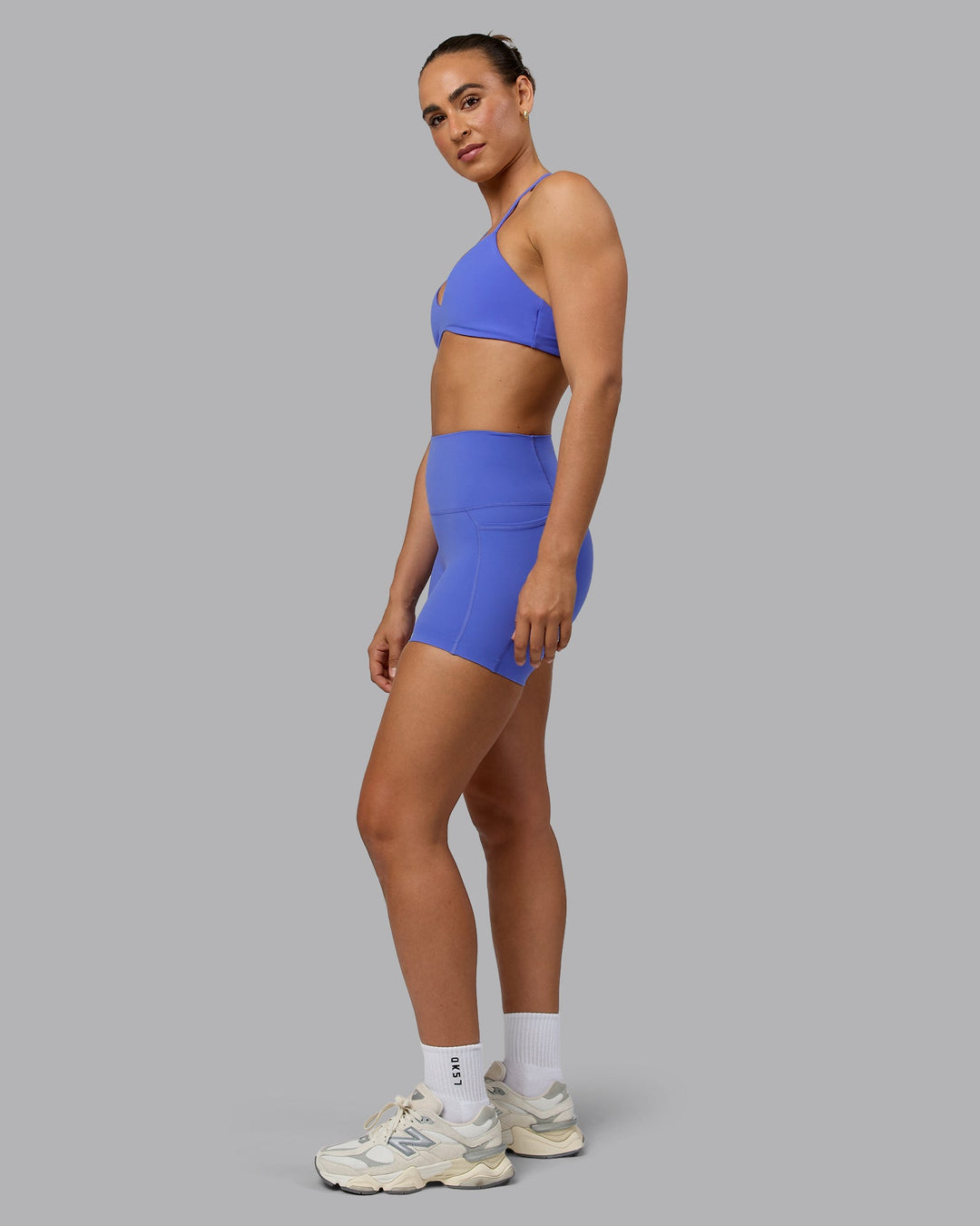 Woman wearing Elixir X-Short Tights With Pockets - Baja Blue