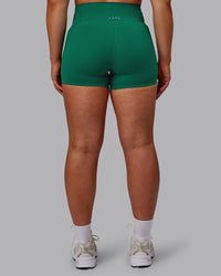 Woman wearing Elixir Ultra High-Rise 4" Short Pockets - Malachite