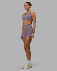 Woman wearing Elixir Ultra High-Rise 4" Short Pockets - Purple Sage