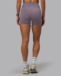 Woman wearing Elixir Ultra High-Rise 4" Short Pockets - Purple Sage