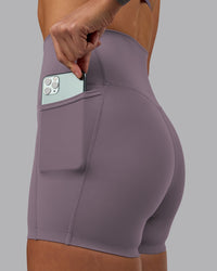 Woman wearing Elixir Ultra High-Rise 4" Short Pockets - Purple Sage