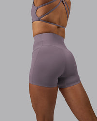 Woman wearing Elixir Ultra High-Rise 4" Short Pockets - Purple Sage
