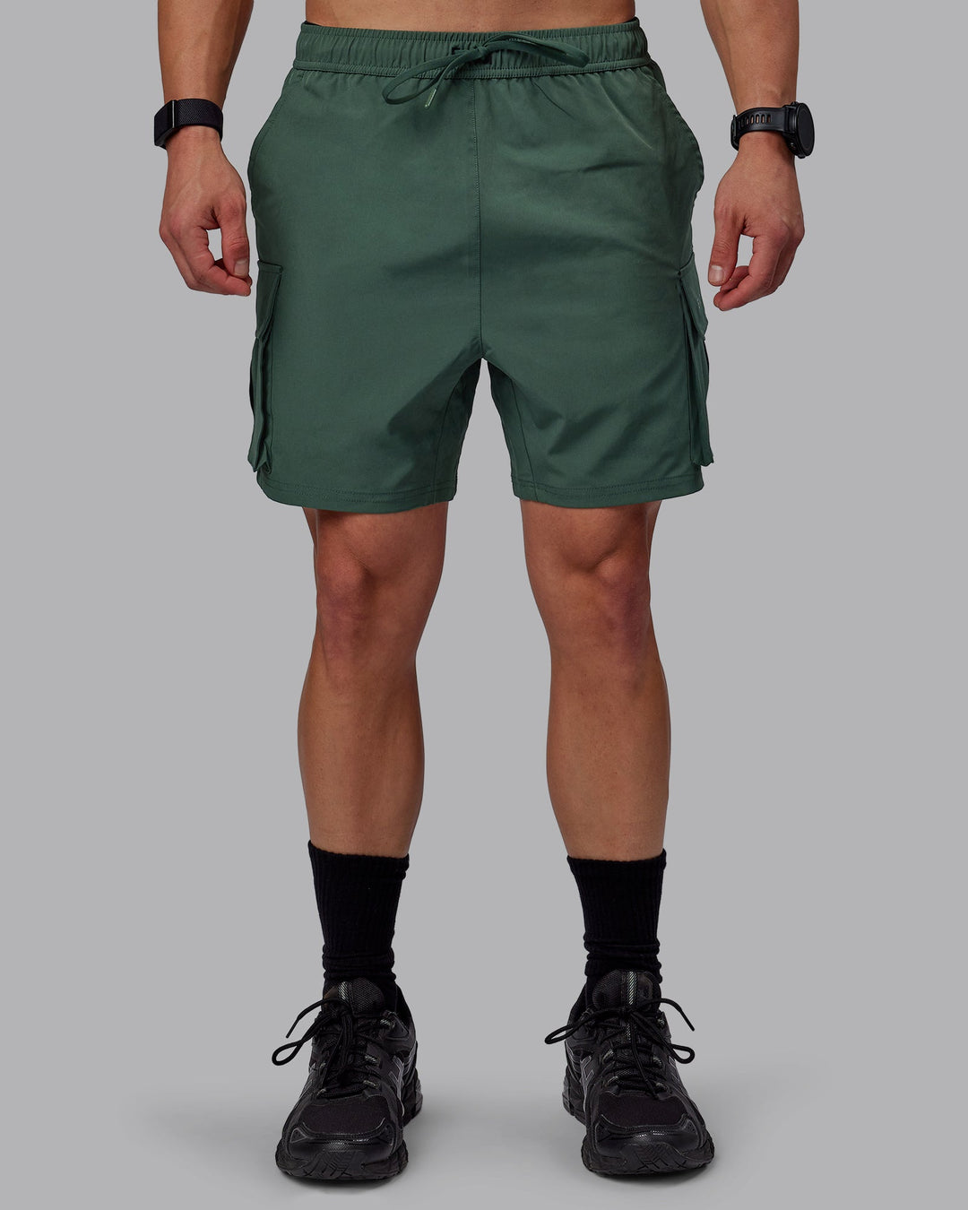 Man wearing Energy Stretch Performance Cargo Shorts - Cilantro