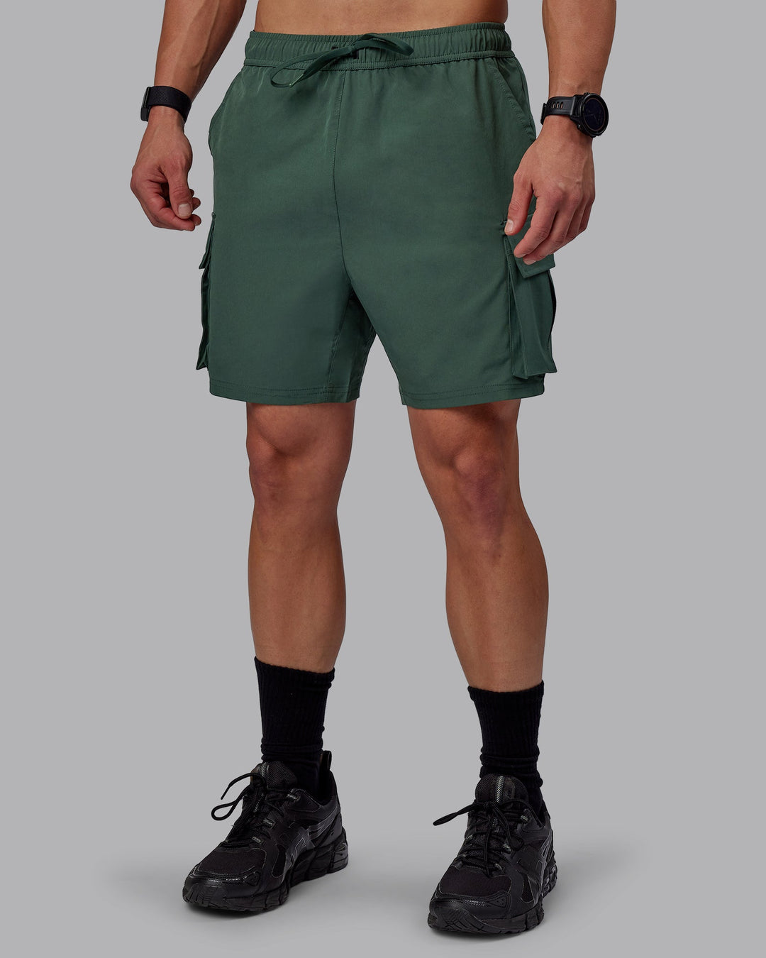 Man wearing Energy Stretch Performance Cargo Shorts - Cilantro