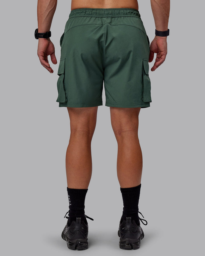 Man wearing Energy Stretch Performance Cargo Shorts - Cilantro
