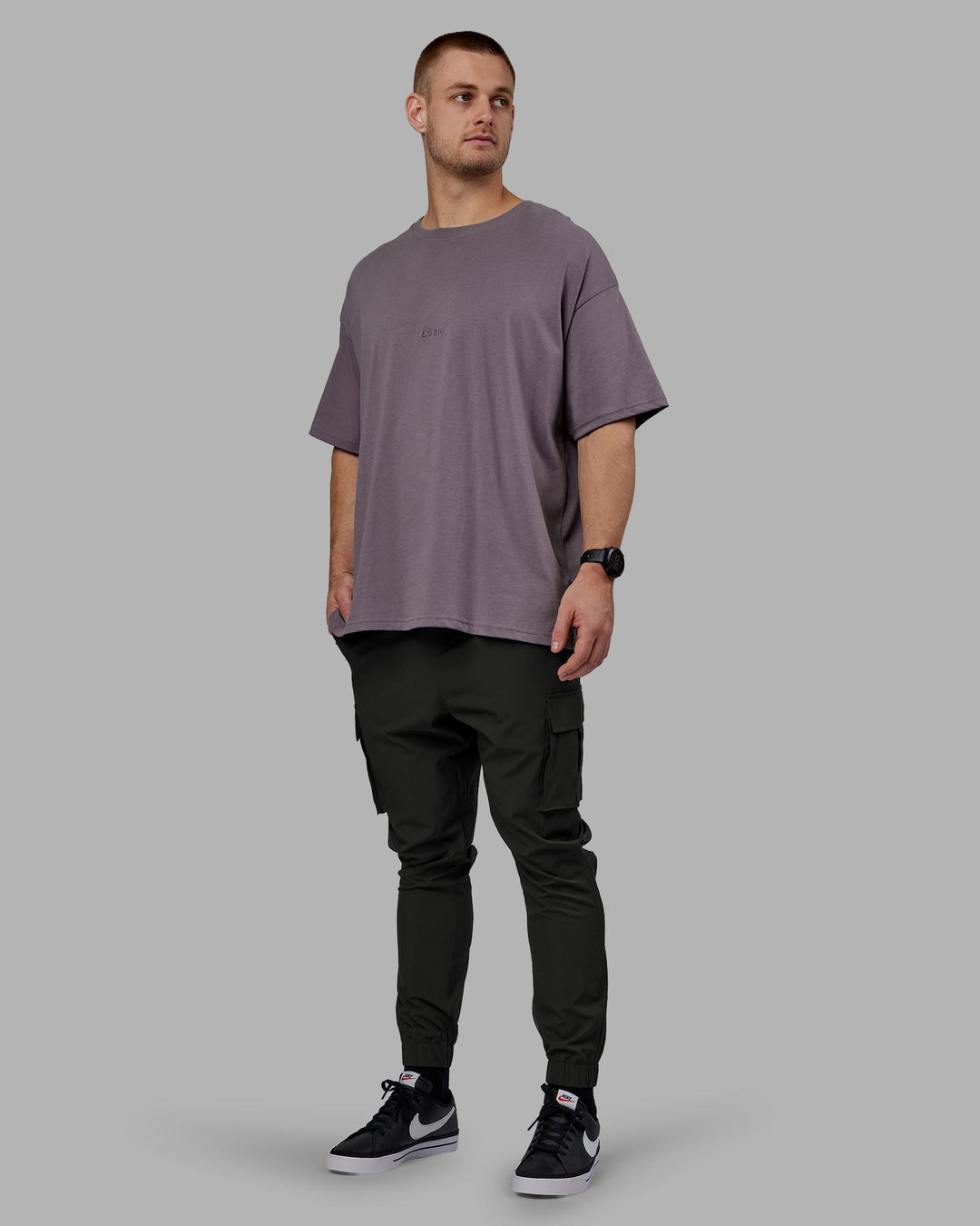 Man wearing Energy Stretch Performance Cargo Joggers - Pirate Black