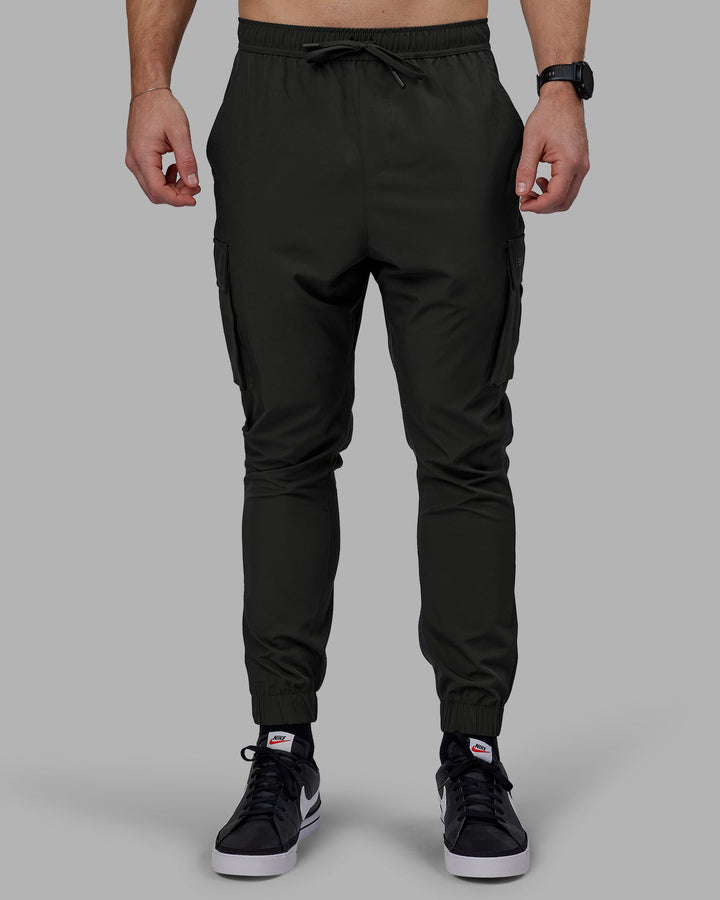 Man wearing Energy Stretch Performance Cargo Joggers - Pirate Black
