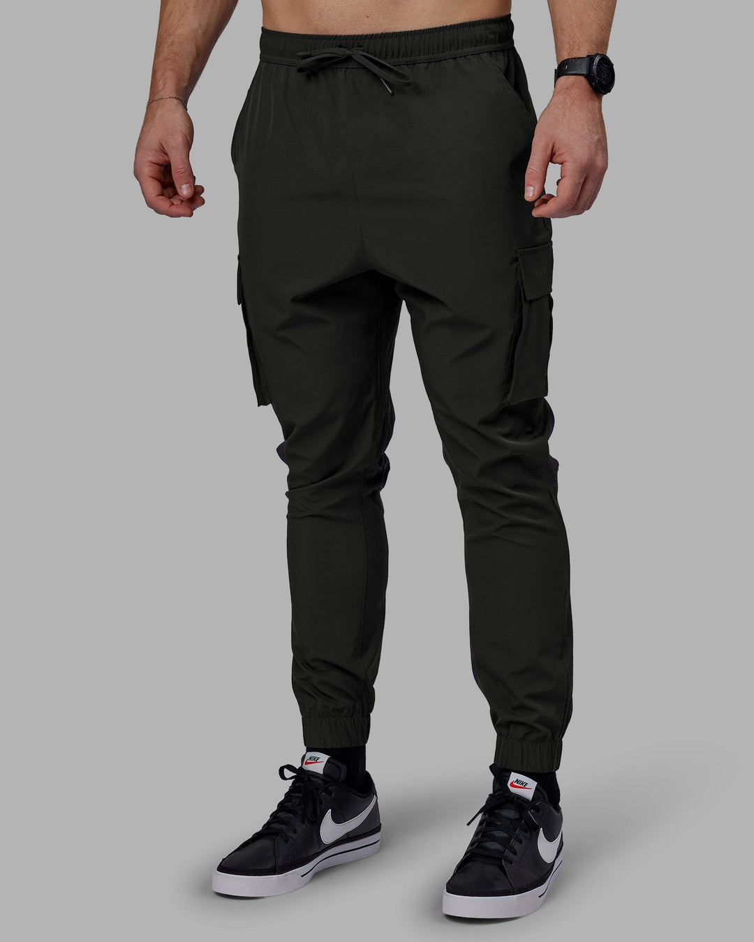 Man wearing Energy Stretch Performance Cargo Joggers - Pirate Black