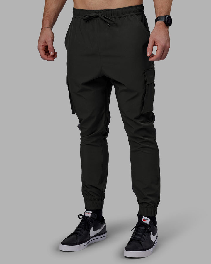 Man wearing Energy Stretch Performance Cargo Joggers - Pirate Black
