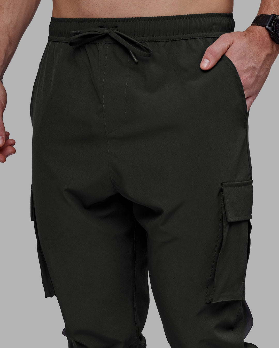 Man wearing Energy Stretch Performance Cargo Joggers - Pirate Black