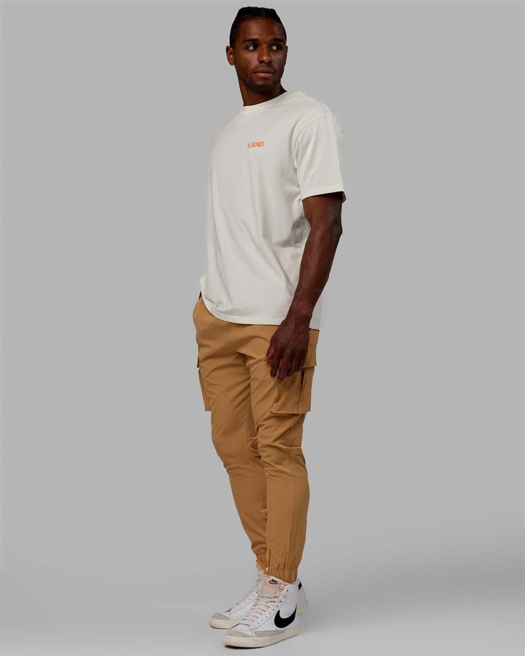 Man wearing Energy Stretch Performance Cargo Joggers - Latte