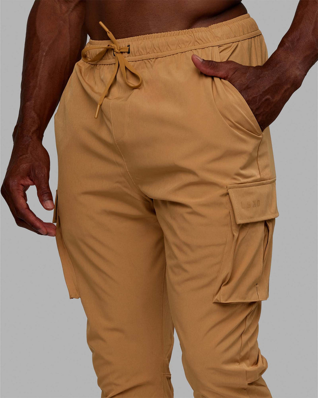 Man wearing Energy Stretch Performance Cargo Joggers - Latte