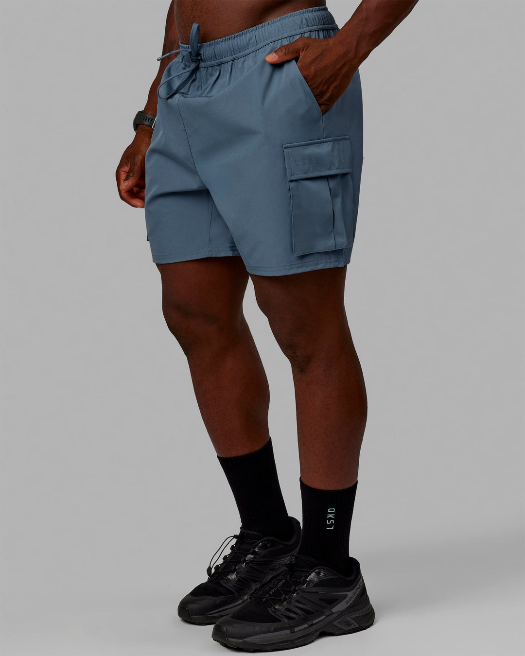 Man wearing Energy Stretch Performance Cargo Shorts - Storm