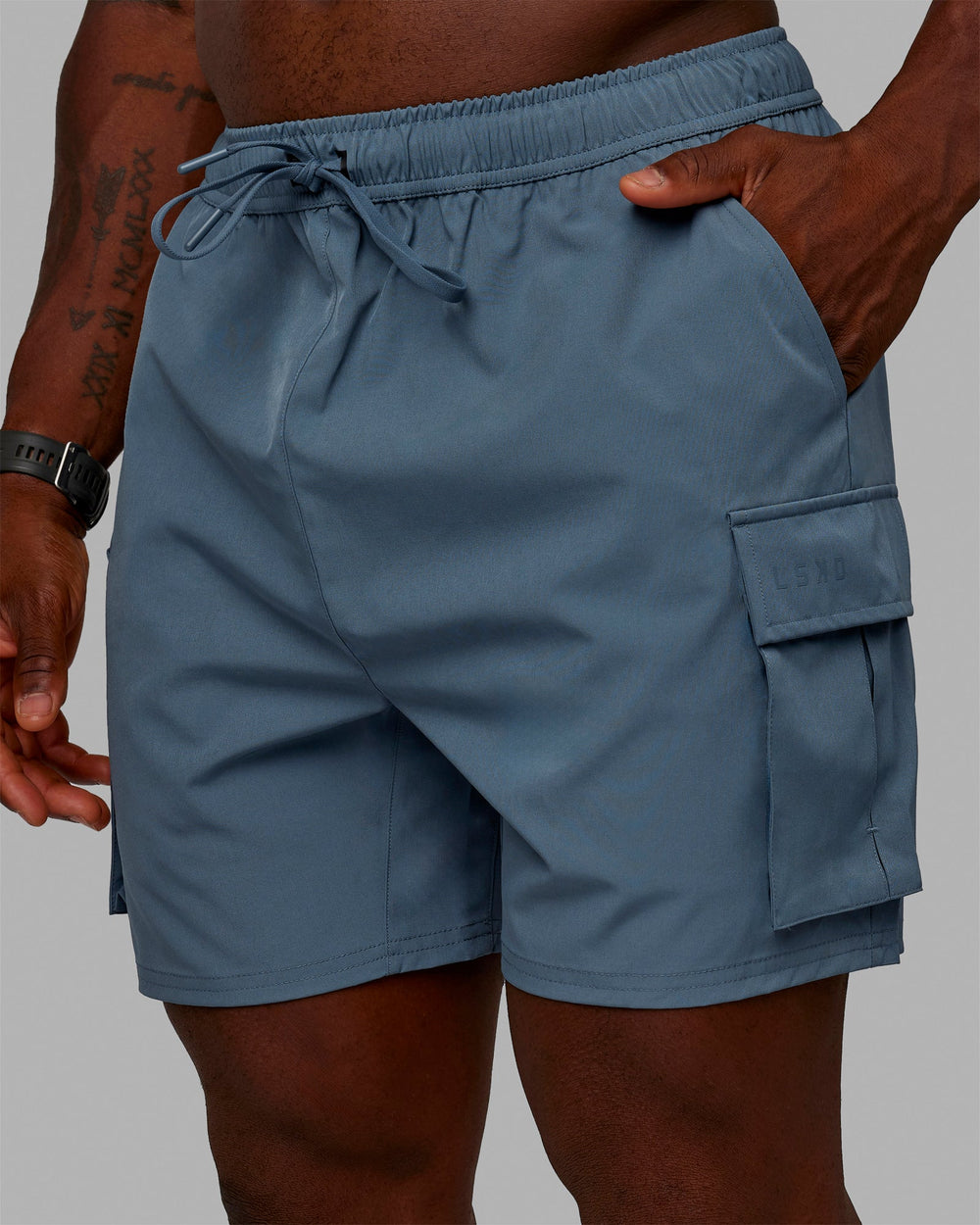 Man wearing Energy Stretch Performance Cargo Shorts - Storm