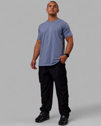 Man wearing Energy Stretch Relaxed Fit Cargo Pants - Black