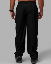 Man wearing Energy Stretch Relaxed Fit Cargo Pants - Black